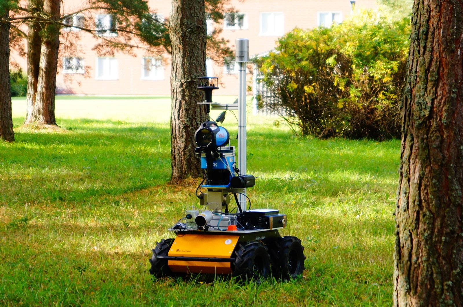 ARMEx, an autonomous mobile robot, in a grassy field