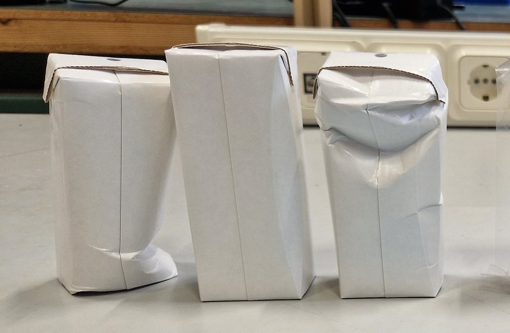 Packaging cartons with visible defects, system inactive